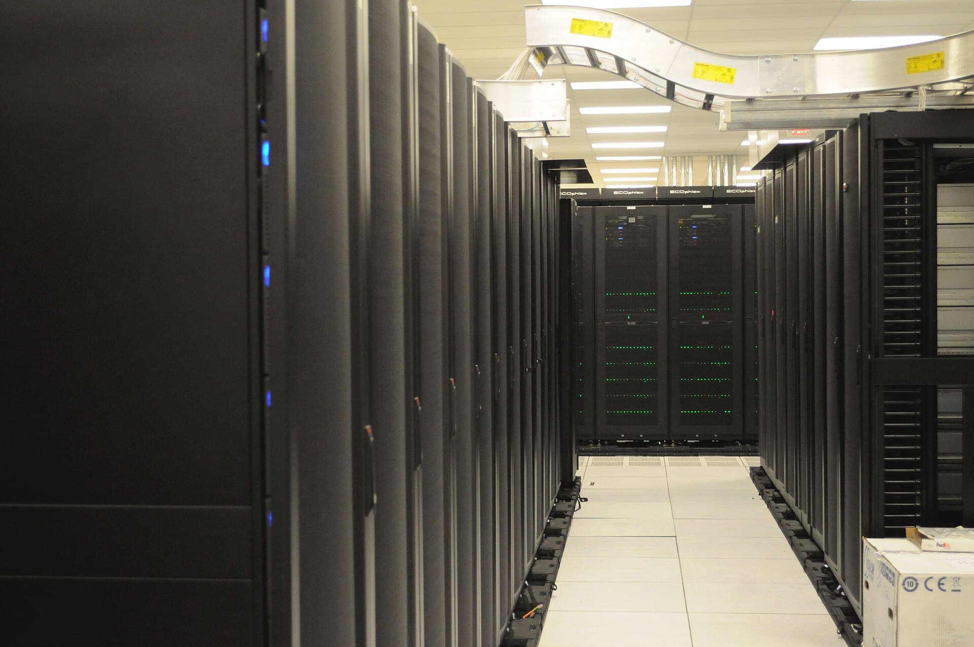 A row of server racks in a data center, representing the AI gateways and cloud infrastructure affected by the poisoned release.
