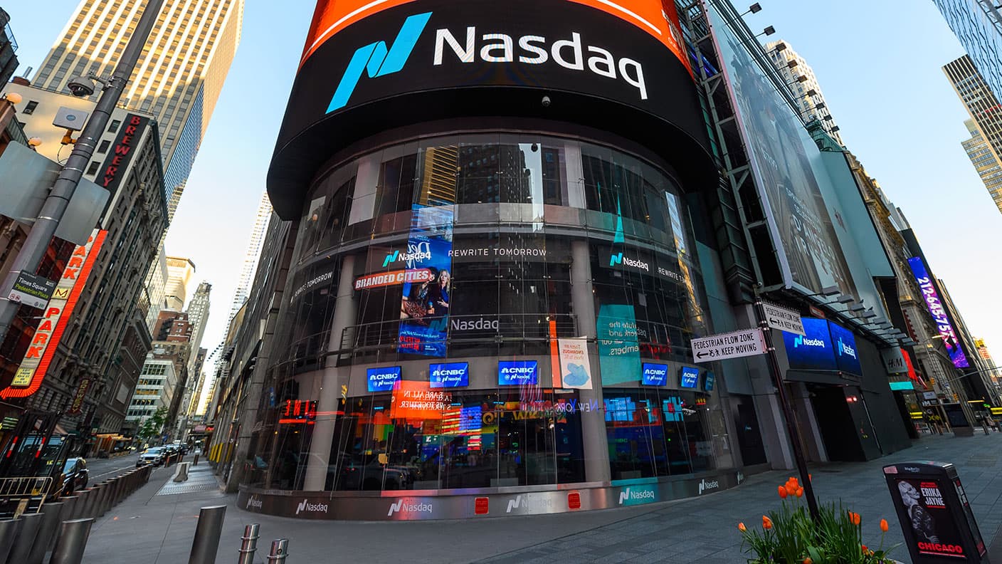 A real photograph of the Nasdaq building exterior at Times Square, not Anthropic's office or a listing event
