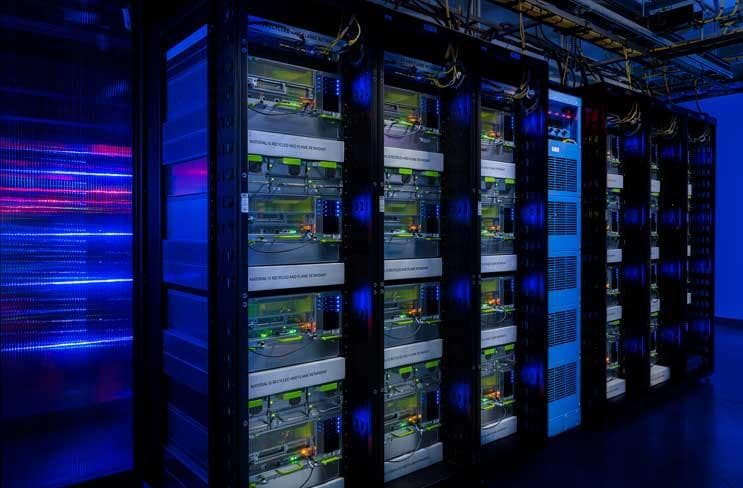Close-up photo of AI server racks with hardware in a data center, representing self-hosted inference infrastructure