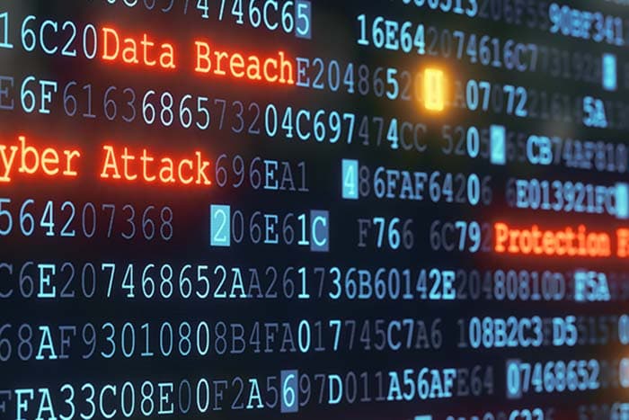 屏幕上显示代码与 Cyber Attack、Data Breach 字样的网络安全主题照片,象征 agent 将漏洞描述武器化的新威胁