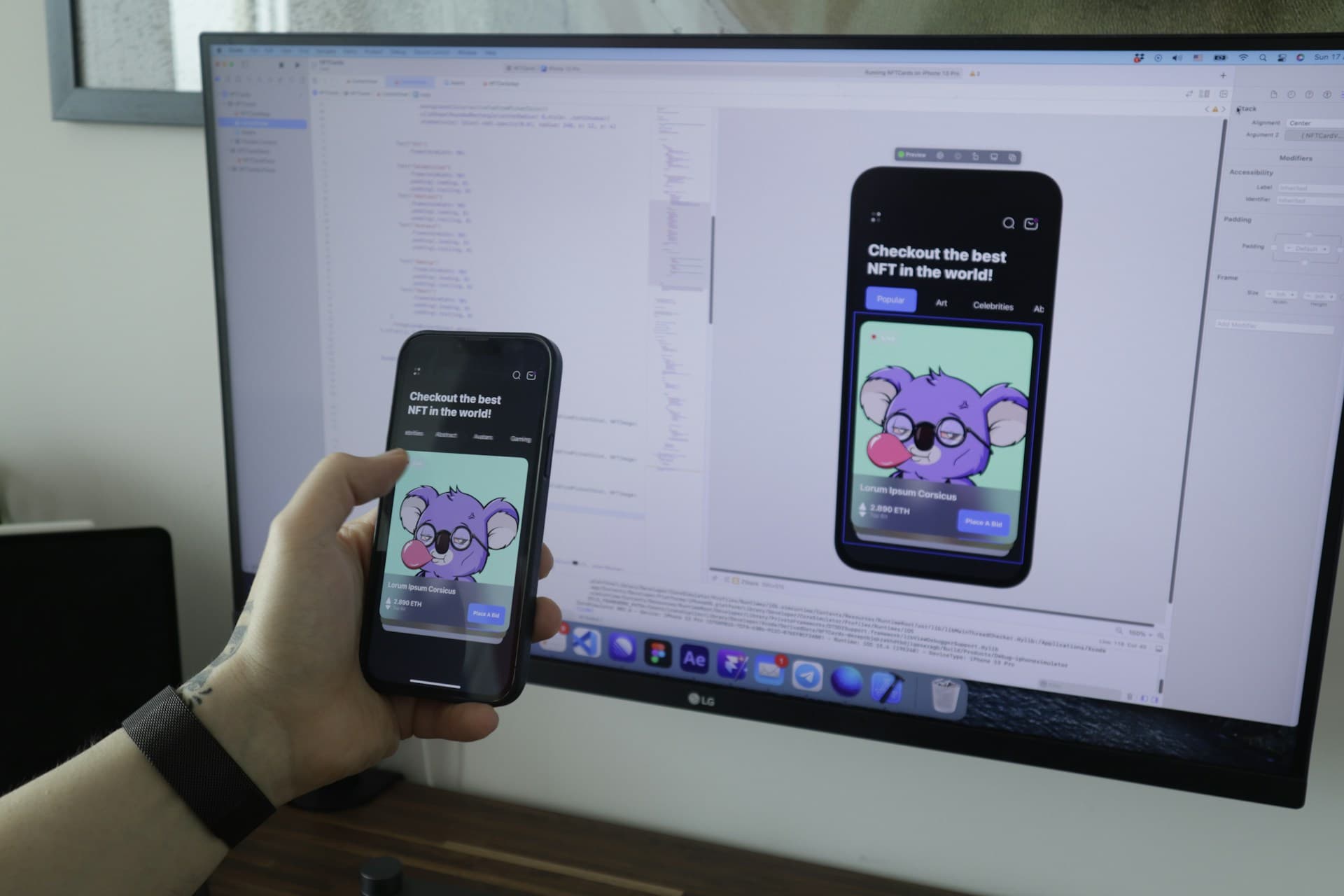 A real photograph of a developer desk with a laptop and a phone simulator side by side, standing in for an agent testing an app in a real desktop session.