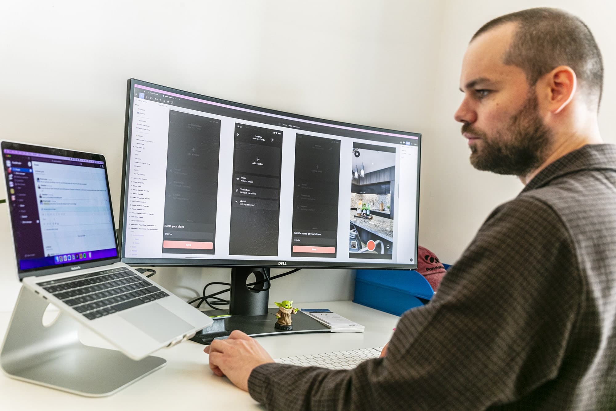 Designer working at a monitor showing mobile app UI designs, illustrating the Figma-to-code pipeline guide (October 2026)