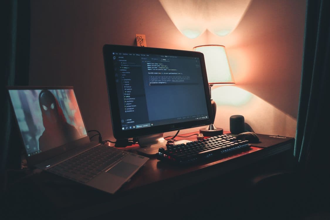 A code editor and red errors late at night: a vibe coding debug session sliding into an endless trial-and-error loop