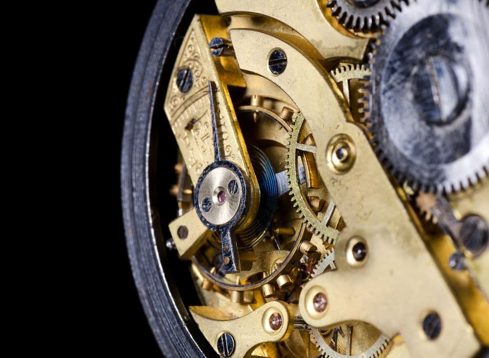 Close-up of an antique watch mechanism; Claude traced the NIST curve seeds to 1997 Unix timestamps