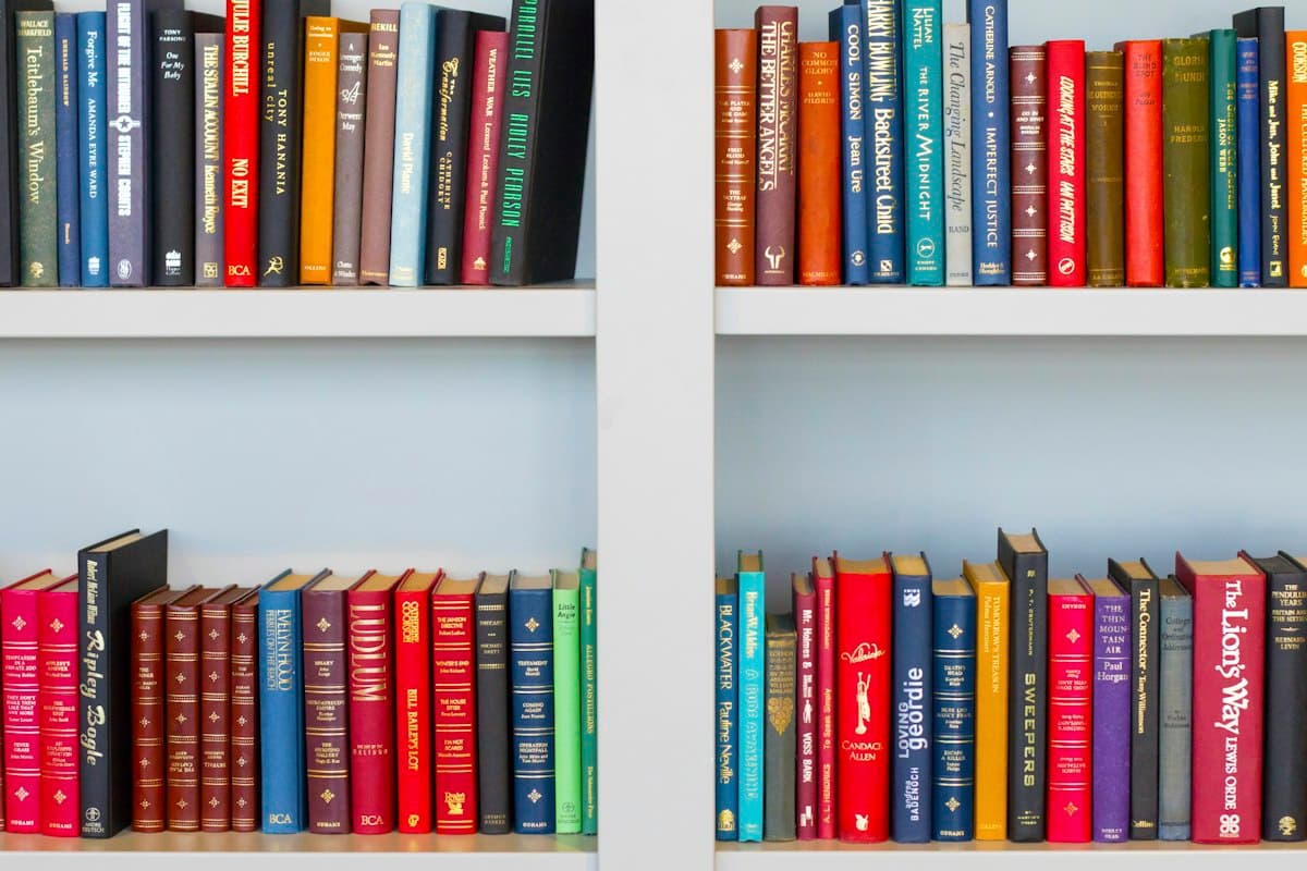 A real photograph of bookshelves full of books, a metaphor for a saved collection, not a screenshot of any product's favorites interface