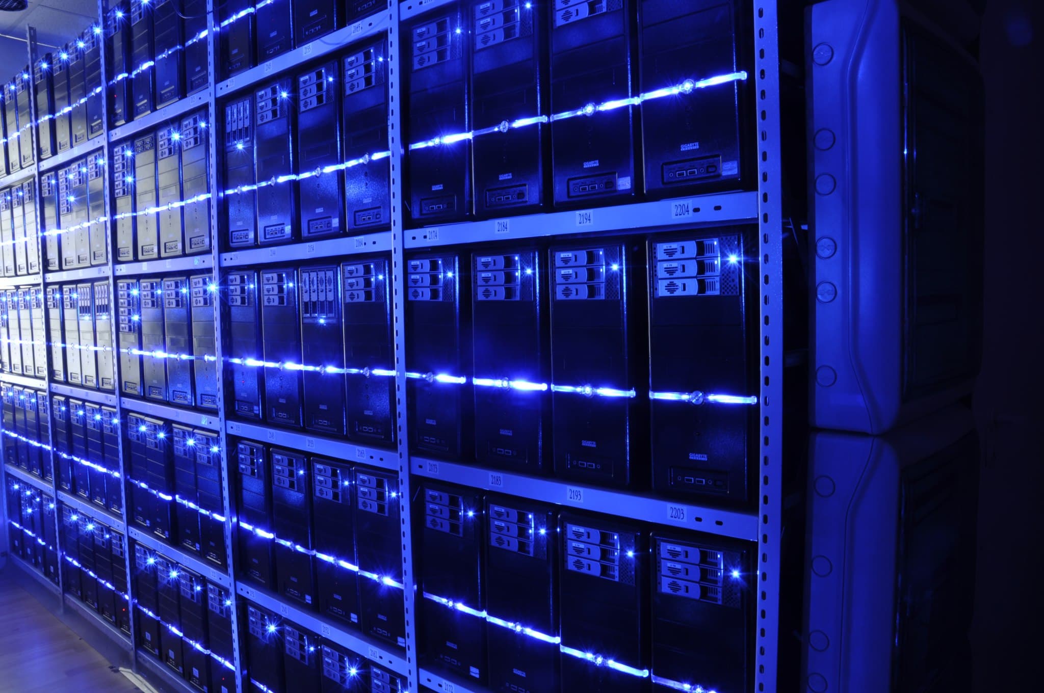 Server room of BalticServers, photographed in 2013: rows of racks with blue status lights, a reminder that every AI feature depends on infrastructure that can fail.