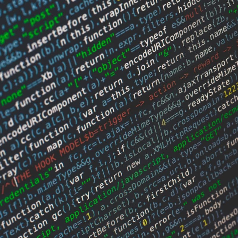 Close-up of code: minified JavaScript on a dark background