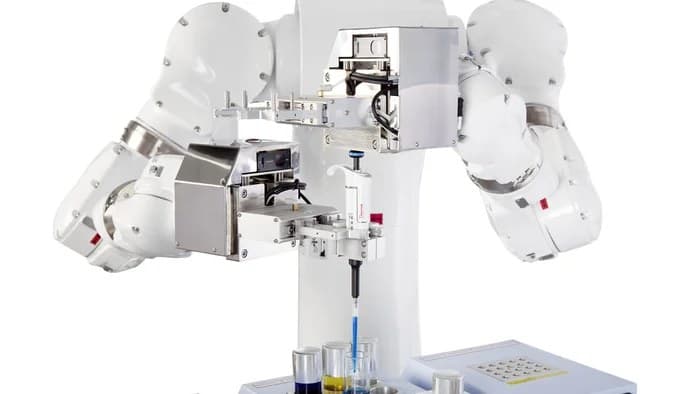 A dual-arm laboratory robot pipetting samples into test tubes