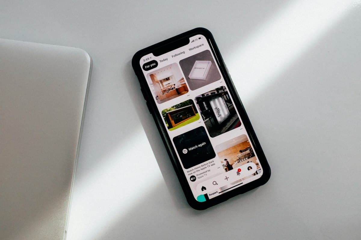 A real photograph of a phone lying on a desk, a metaphor for copying on mobile, not a screenshot of any clipboard interface