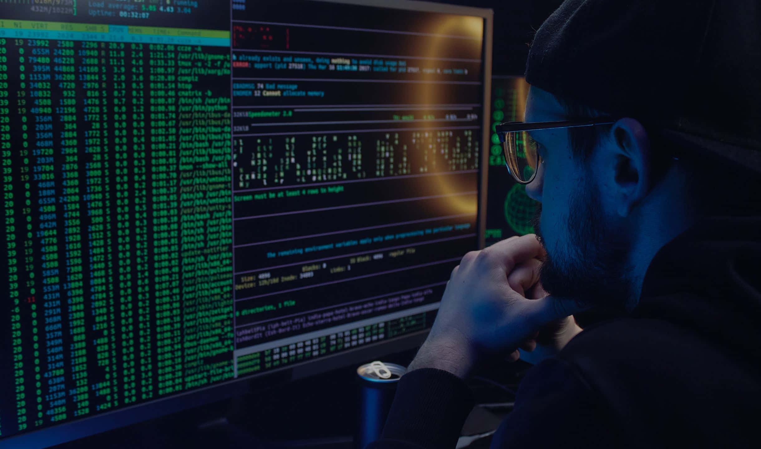 A developer reviewing code and documentation late at night