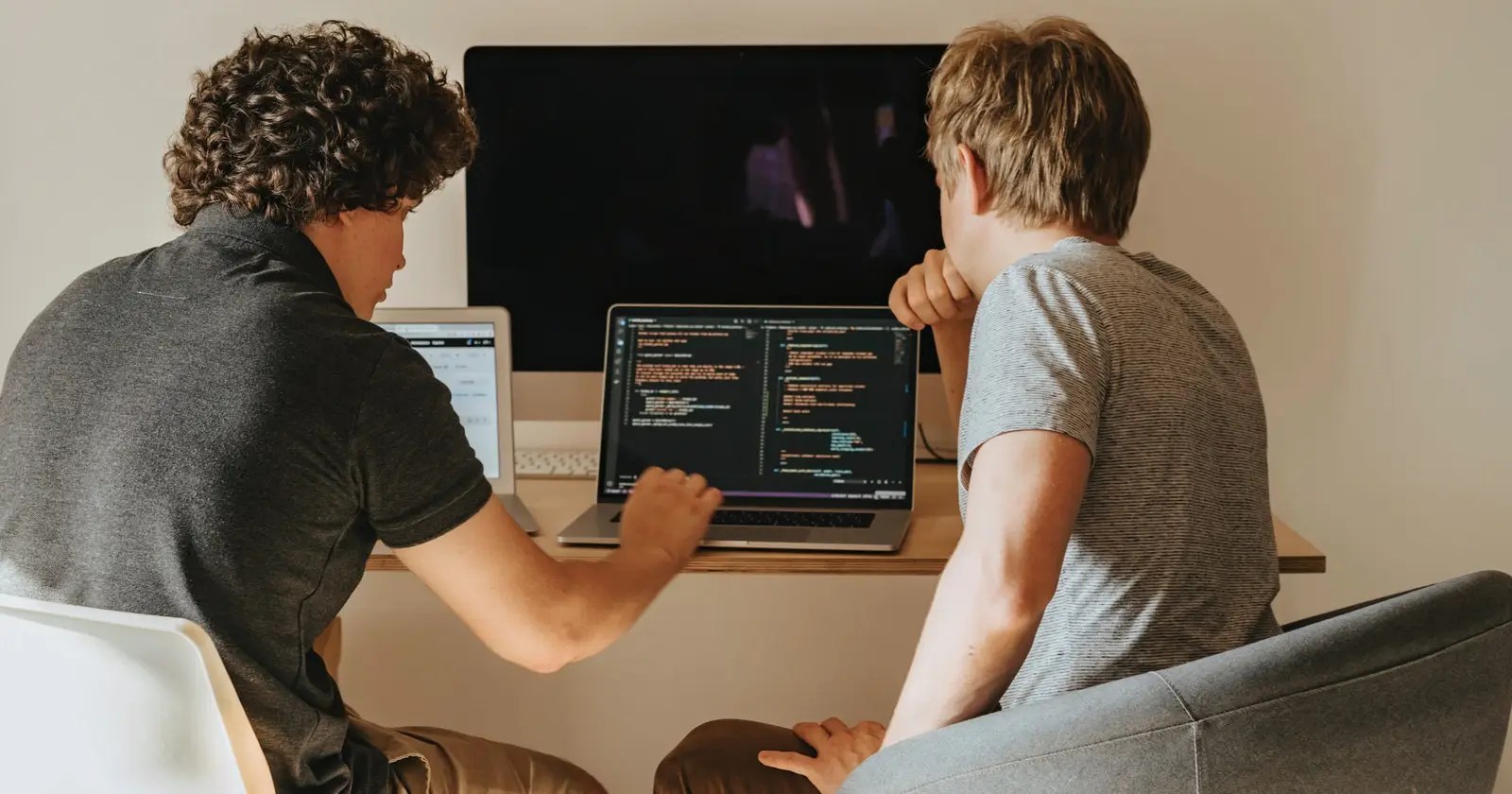 AI pair programming illustration: developer collaborating with an AI assistant on code