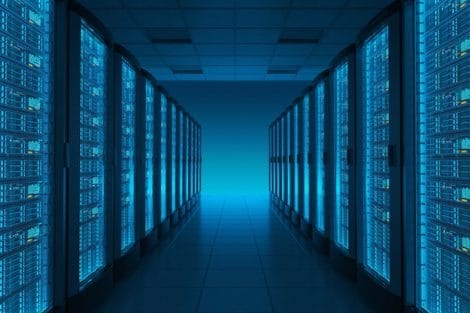 Real photo: data center server corridor under blue lighting
