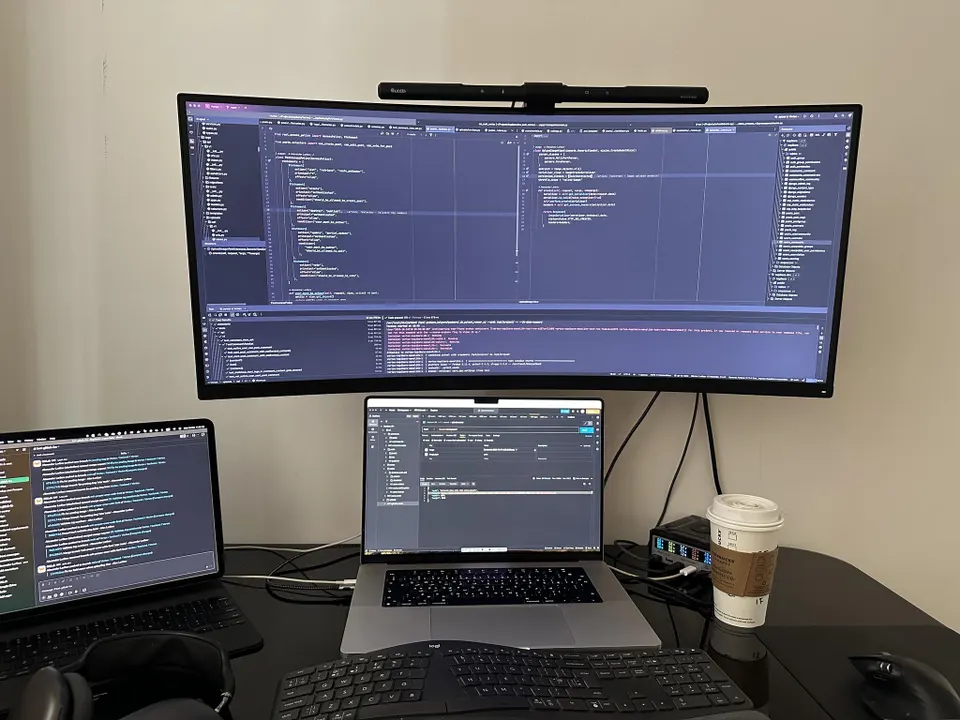 Illustration of one developer directing four AI coding agents working in parallel, with task boards and merge flow