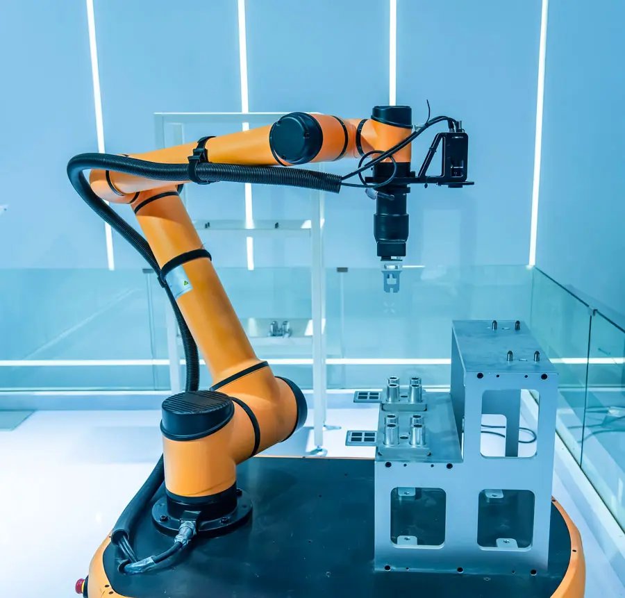 An orange collaborative robot arm in a clean laboratory