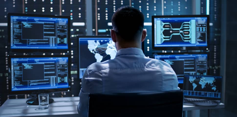 A security researcher staring at vulnerability scan reports on screen: Anthropic expands its Cyber Verification Program